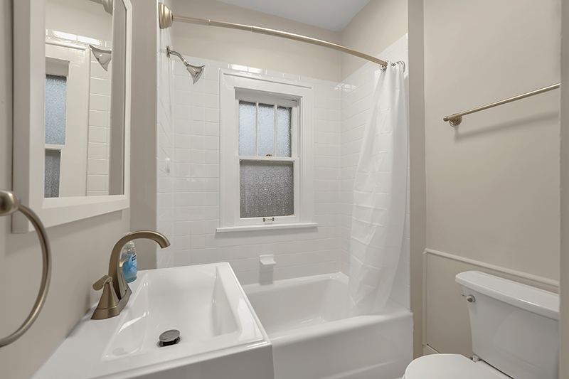 4716 Douglas Road Downers Grove, IL 60515 - Photo 11 of 18 a bathroom with a sink toilet and shower