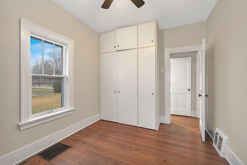4716 Douglas Road Downers Grove, IL 60515 - Photo 12 of 18 a view of an empty room with wooden floor and a window
