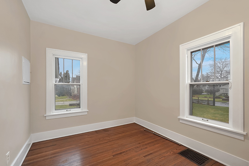 4716 Douglas Road Downers Grove, IL 60515 - Photo 13 of 18 a view of an empty room with wooden floor and a window