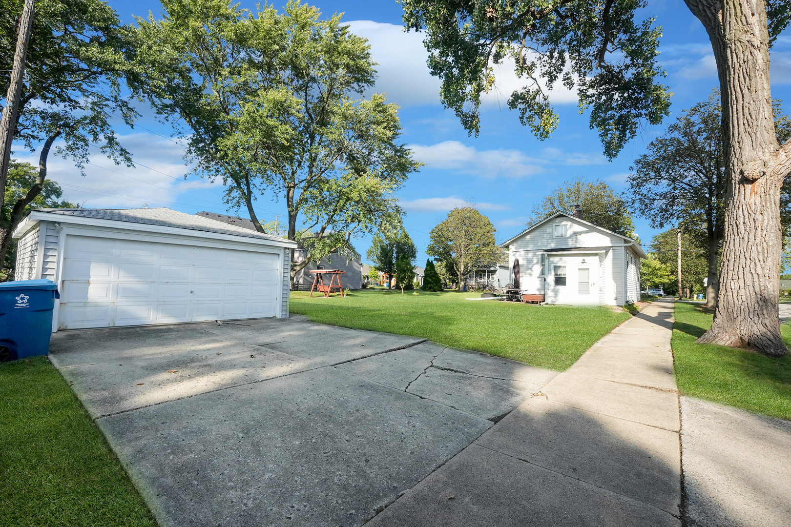 4716 Douglas Road Downers Grove, IL 60515 - Photo 18 of 18 a view of a house with a yard and large tree