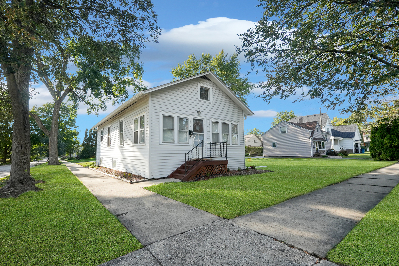 4716 Douglas Road Downers Grove, IL 60515 - Photo 2 of 18 a front view of house with yard and green space