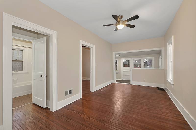 4716 Douglas Road Downers Grove, IL 60515 - Photo 5 of 18 a view of an empty room with window and wooden floor