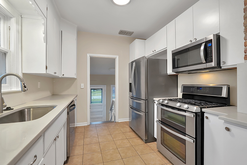 4716 Douglas Road Downers Grove, IL 60515 - Photo 6 of 18 a kitchen with stainless steel appliances a refrigerator stove and microwave