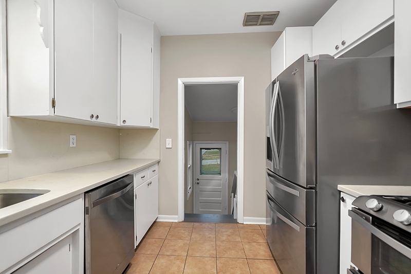 4716 Douglas Road Downers Grove, IL 60515 - Photo 7 of 18 a kitchen with stainless steel appliances a refrigerator and a sink