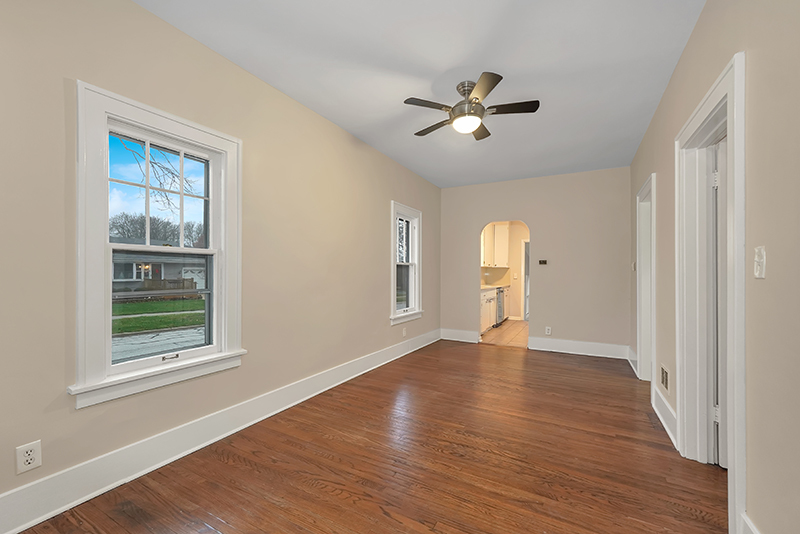 4716 Douglas Road Downers Grove, IL 60515 - Photo 8 of 18 a view of empty room with wooden floor and fan
