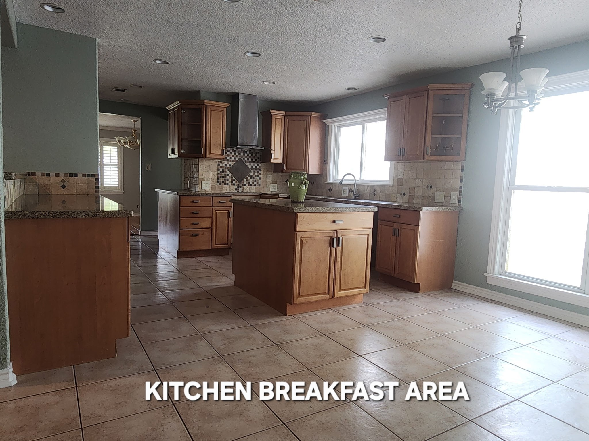 941 Magnolia Street Lake Jackson, TX 77566 - Photo 2 of 26 a large kitchen with stainless steel appliances granite countertop a stove a sink and a refrigerator