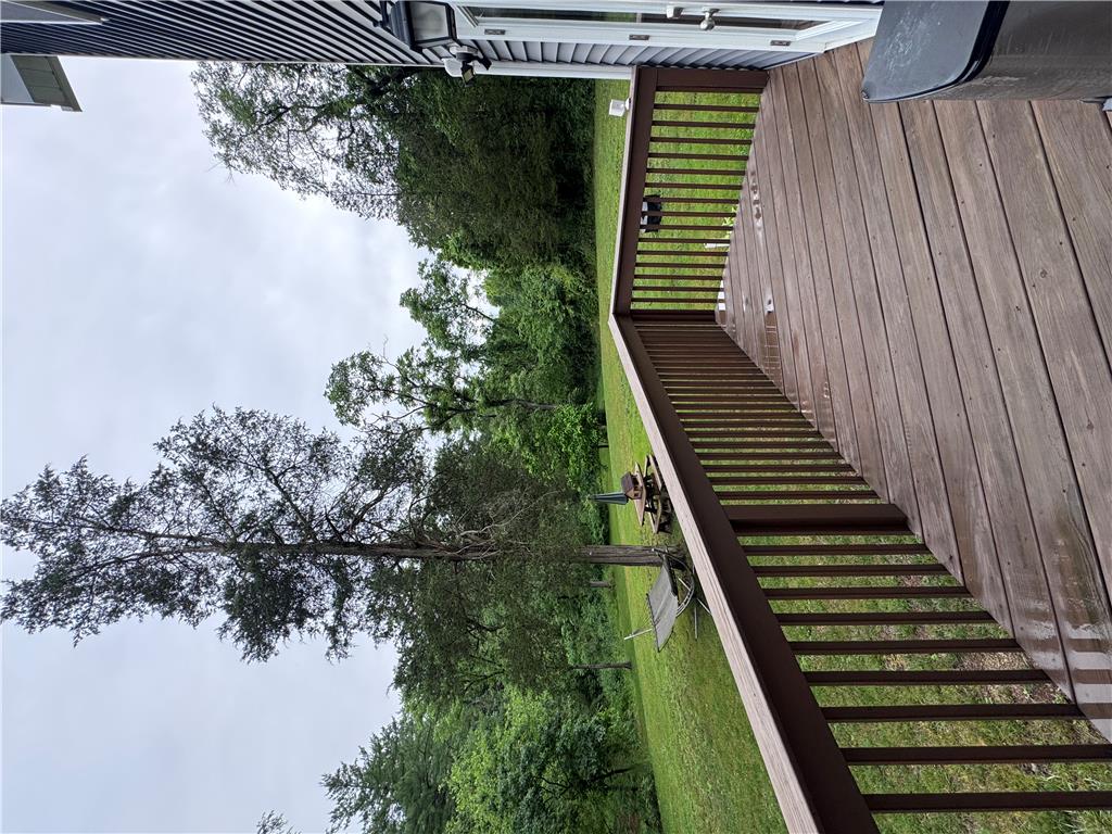 130 Hidden Spur Road Lehighton, PA 18235 - Photo 17 of 19 A spacious wooden deck provides ample outdoor living space, overlooking a verdant landscape.