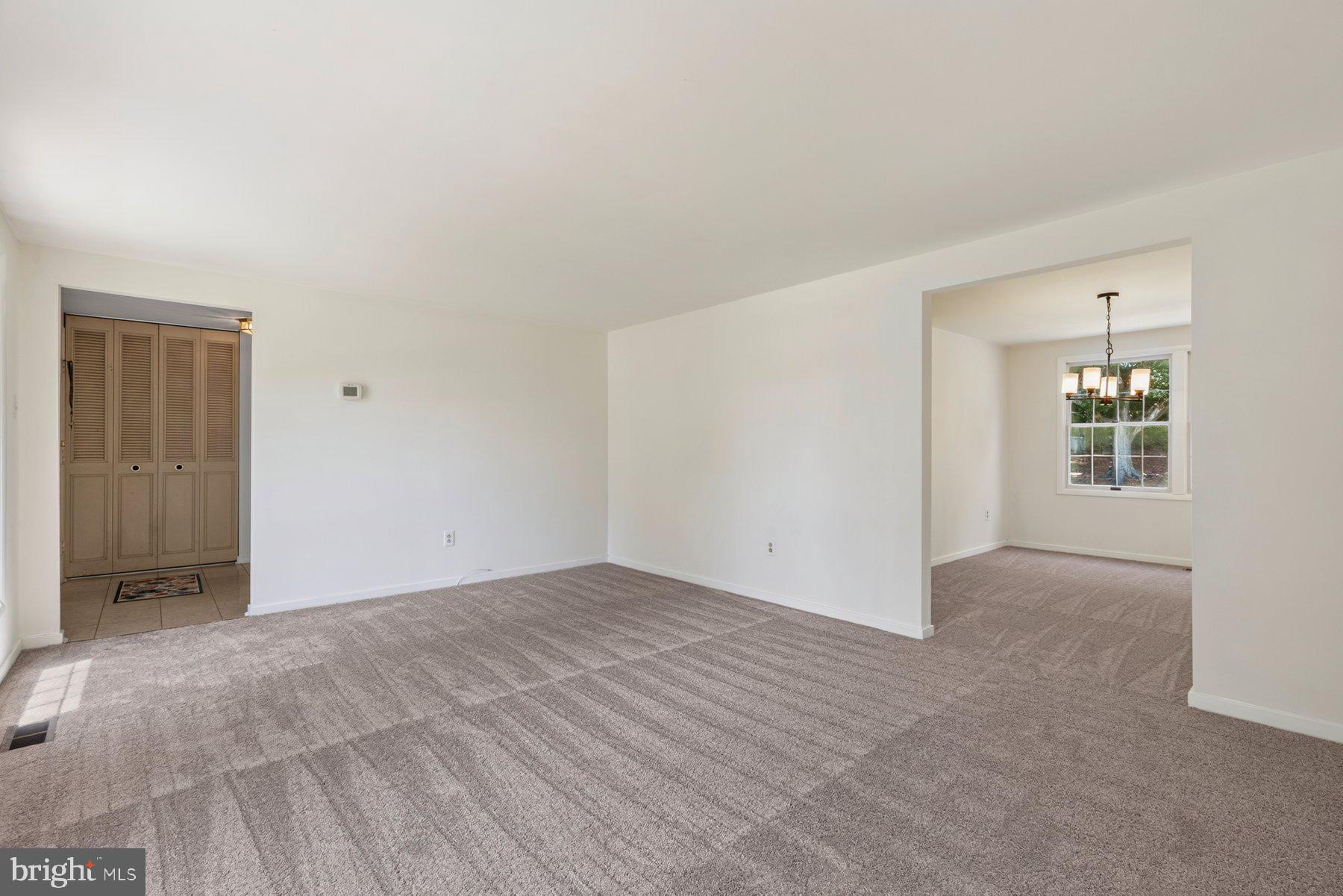 Living room with view of dining room