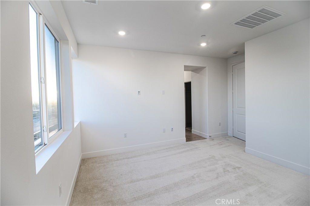 635 Gadwall Irvine, CA 92618 - Photo 17 of 27 an empty room with windows and closet