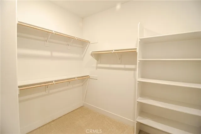 a view of an empty walk in closet