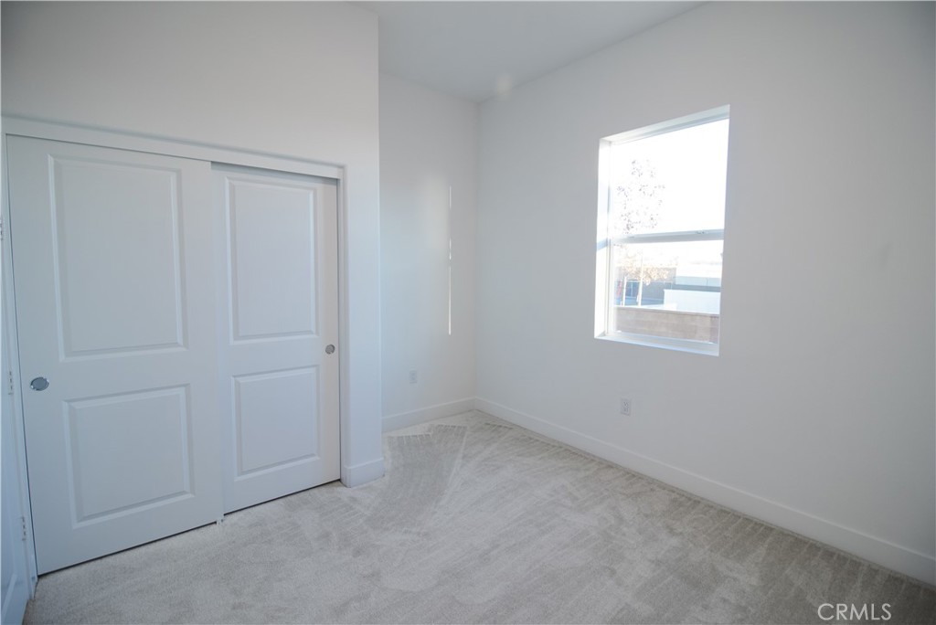 635 Gadwall Irvine, CA 92618 - Photo 8 of 27 an empty room with windows