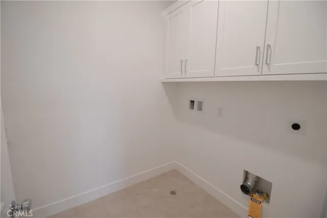 a bathroom with white cabinets