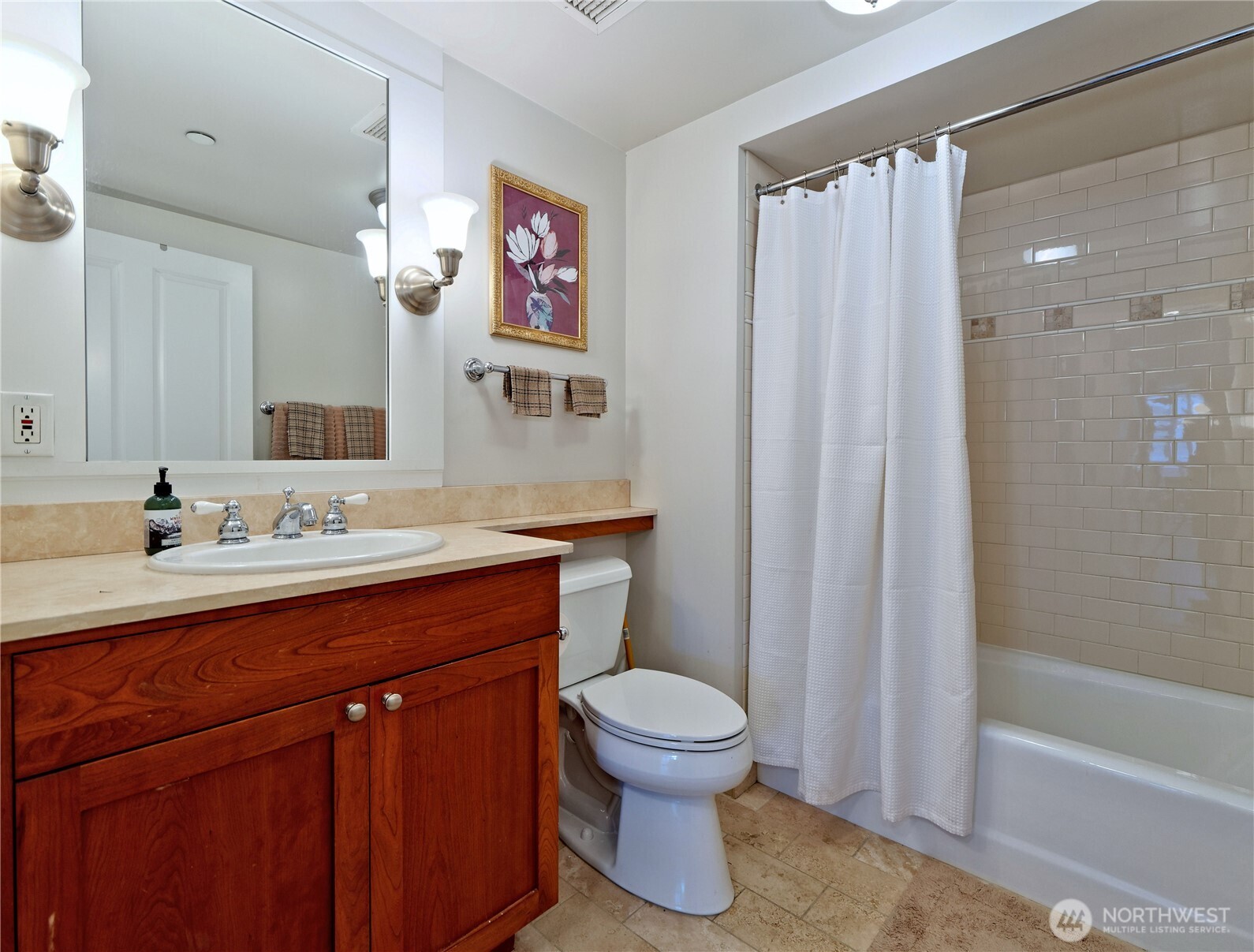 1500 4th Avenue, Unit 905 Seattle, WA 98101 - Photo 12 of 20 a spacious bathroom with a sink a toilet and shower