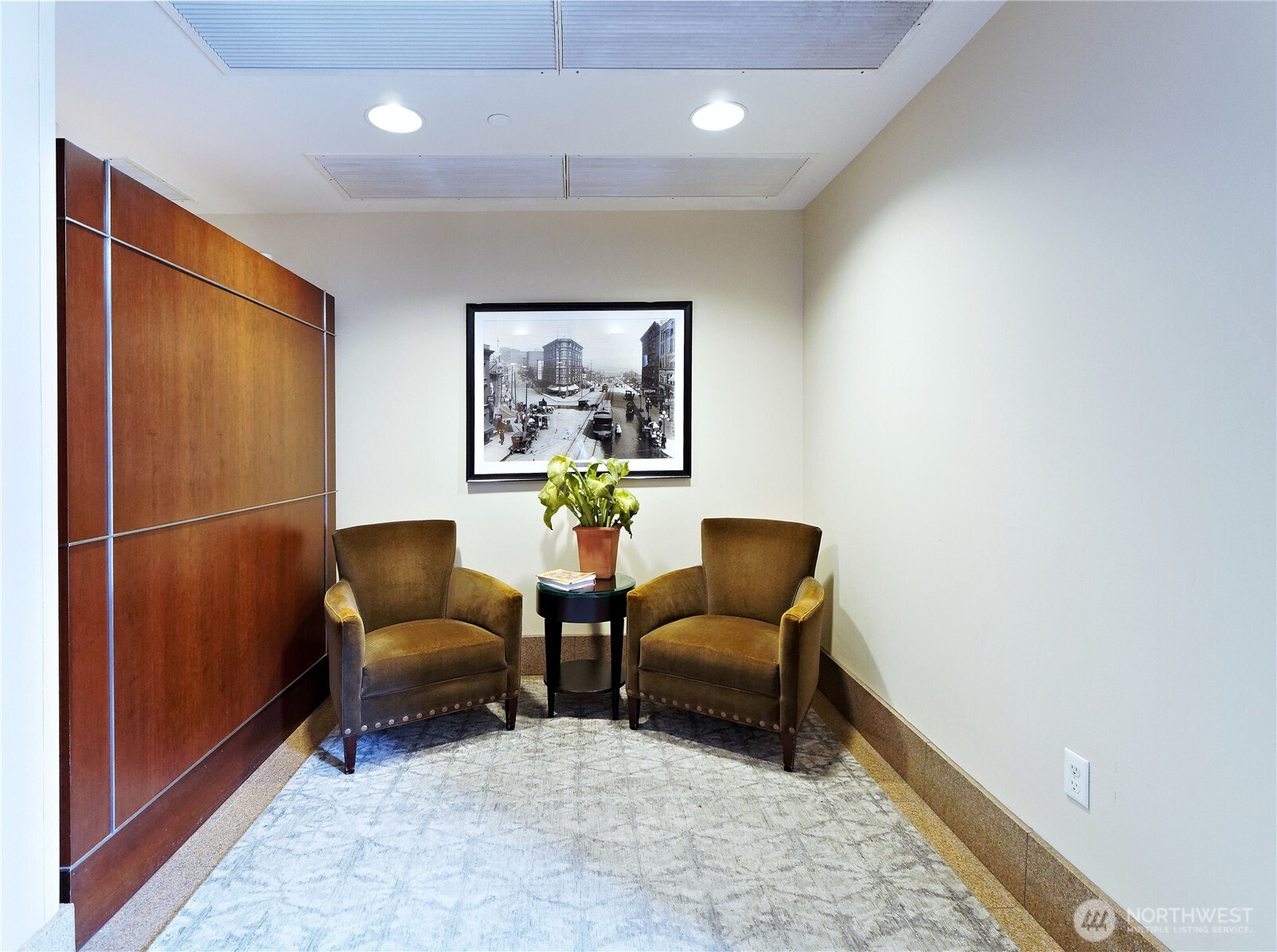 1500 4th Avenue, Unit 905 Seattle, WA 98101 - Photo 14 of 20 a hallway with a couch and a potted plant