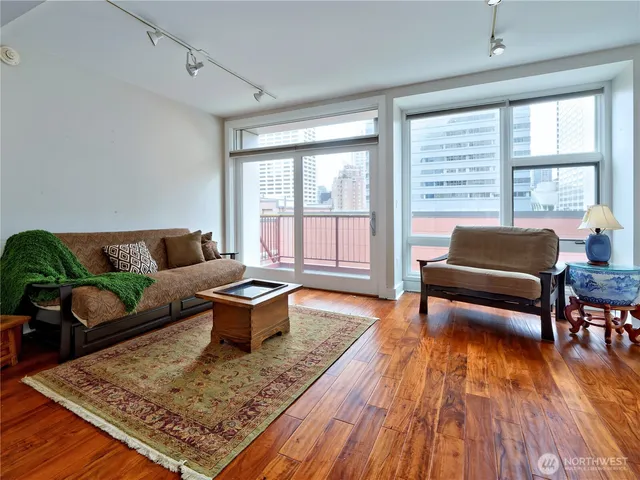 a living room with furniture and a rug