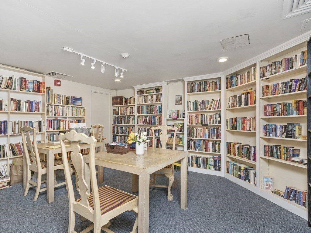280 Boylston Street, Unit 415 Newton, MA 02467 - Photo 14 of 18 a work room with furniture and a book shelf