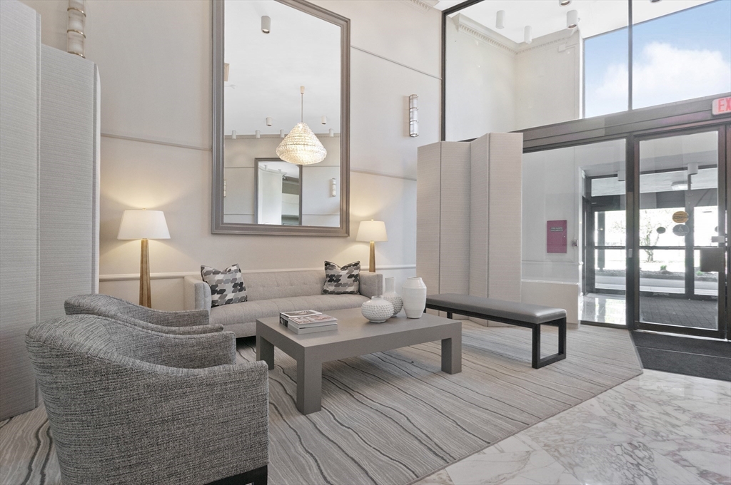 280 Boylston Street, Unit 415 Newton, MA 02467 - Photo 2 of 18 a living room with furniture