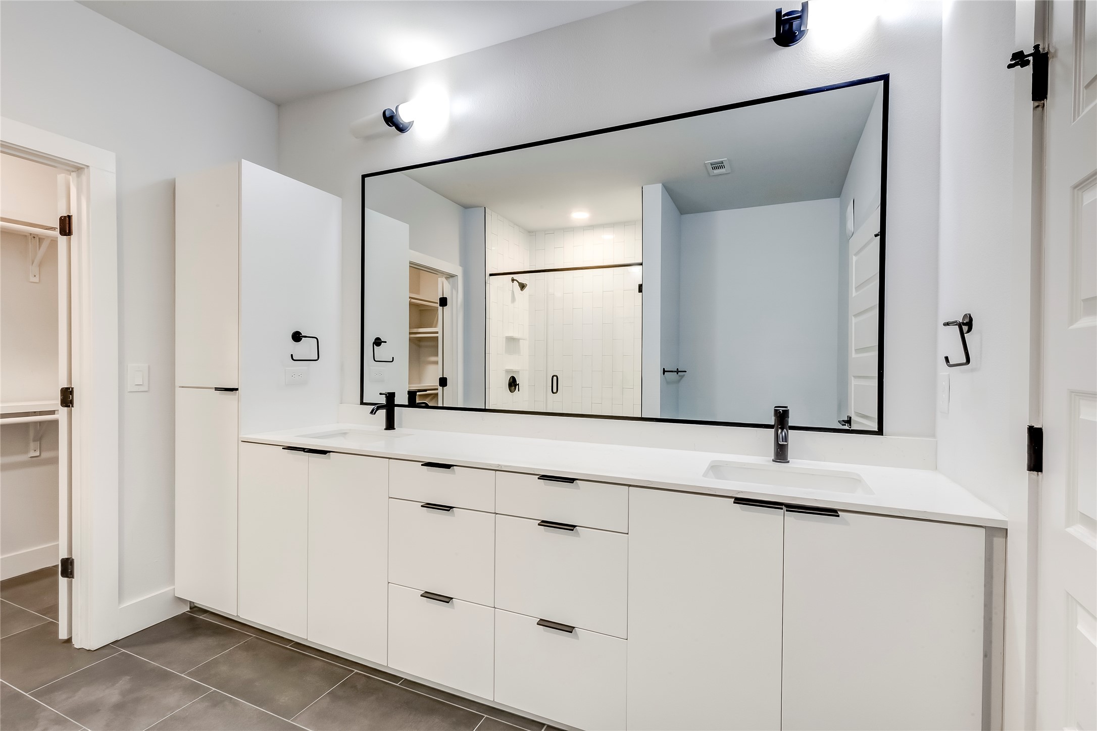 2500 Longview Street, Unit 402 Austin, TX 78705 - Photo 16 of 27 a bathroom with a sink and a mirror