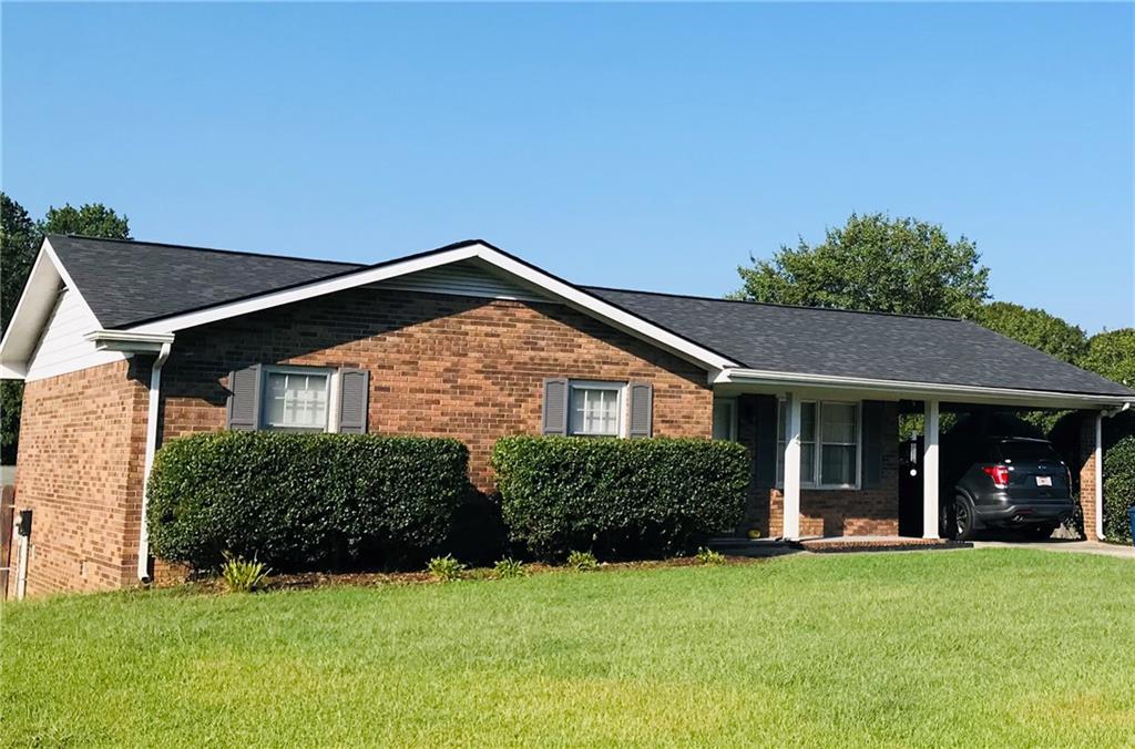 411 North Ridge Lane Winder, GA 30680 - Photo 1 of 1 a front view of a house with a yard