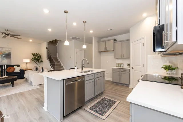 a view of a room with wooden floor and stairs