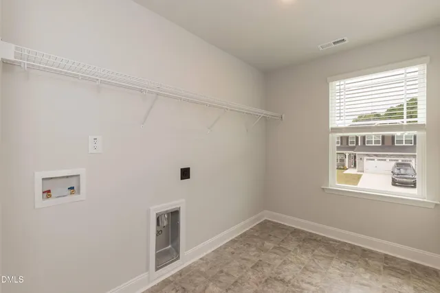 an empty room with a ceiling fan and a ceiling fan