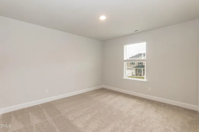 a swimming pool with trees in the background