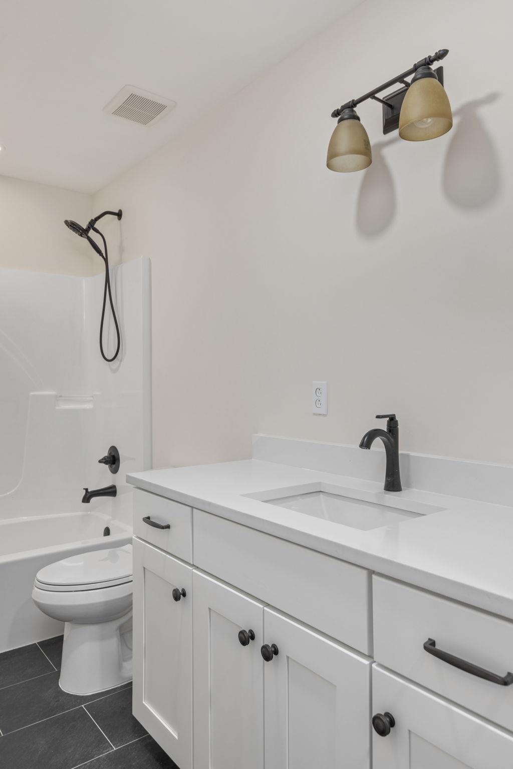 17 County Road 233 Corinth, MS 38834 - Photo 22 of 40 Bathroom with vanity, tile patterned floors, and shower / bath combination