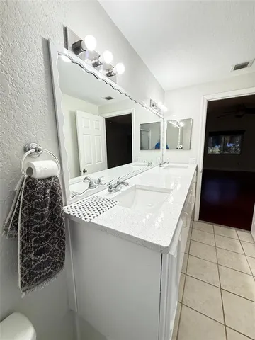 a bathroom with a shower and a mirror