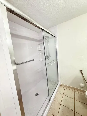 an empty room with a empty space and a ceiling fan