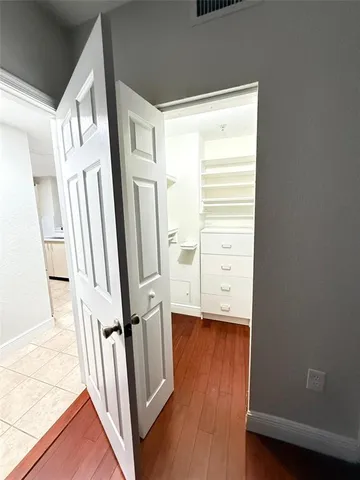 an empty room with wooden floor