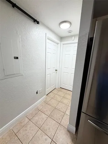 a view of a kitchen with a sink and a fireplace