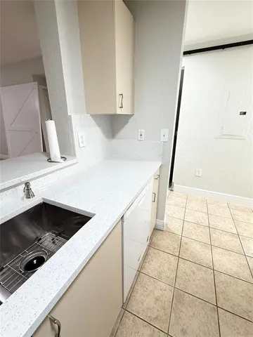 a kitchen with stainless steel appliances a refrigerator and a sink