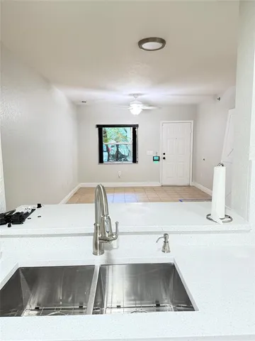 a kitchen with stainless steel appliances a refrigerator sink and stove