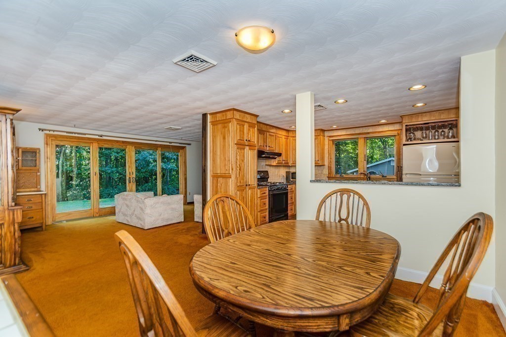 7 Ruthellen Road Chelmsford, MA 01824 - Photo 15 of 40 a view of a dining room with furniture window and outside view
