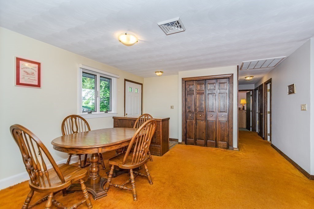 7 Ruthellen Road Chelmsford, MA 01824 - Photo 17 of 40 a dining room with furniture and window