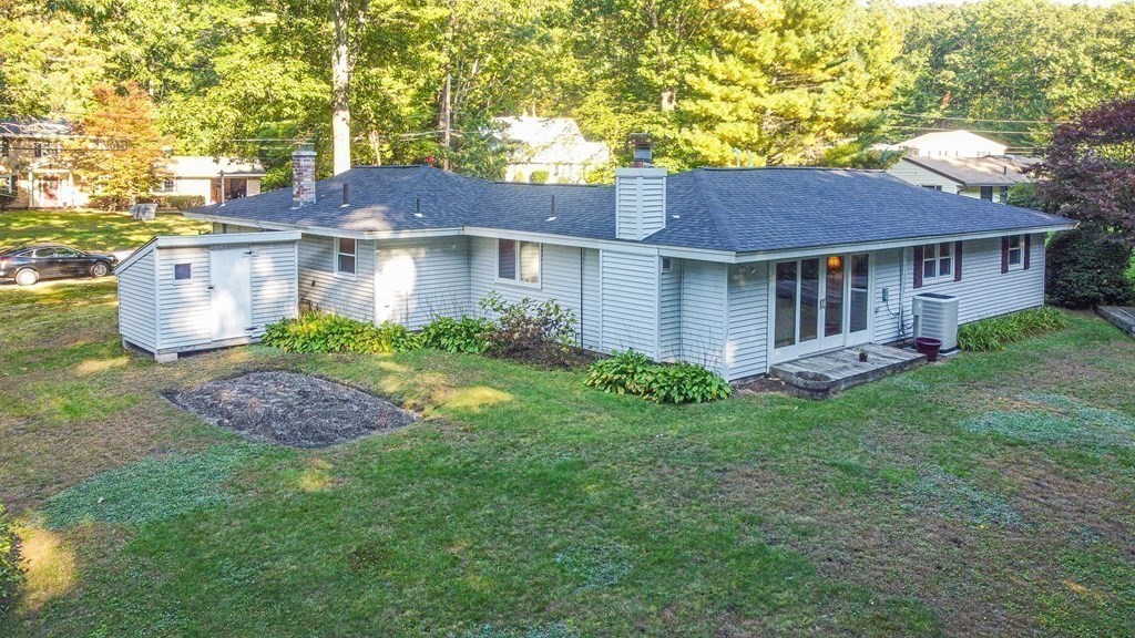 7 Ruthellen Road Chelmsford, MA 01824 - Photo 3 of 40 a view of a yard in front of a house with large windows