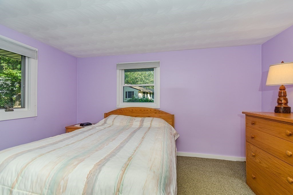 7 Ruthellen Road Chelmsford, MA 01824 - Photo 32 of 40 a bed room with a bed and a dresser