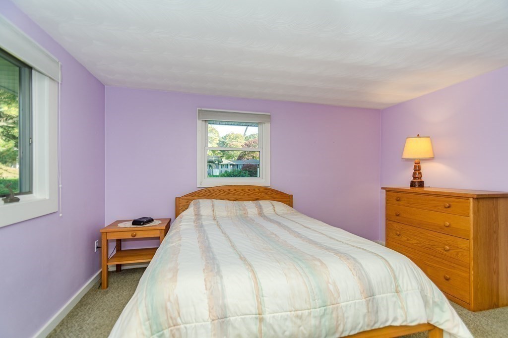 7 Ruthellen Road Chelmsford, MA 01824 - Photo 33 of 40 a bedroom with a bed and a window