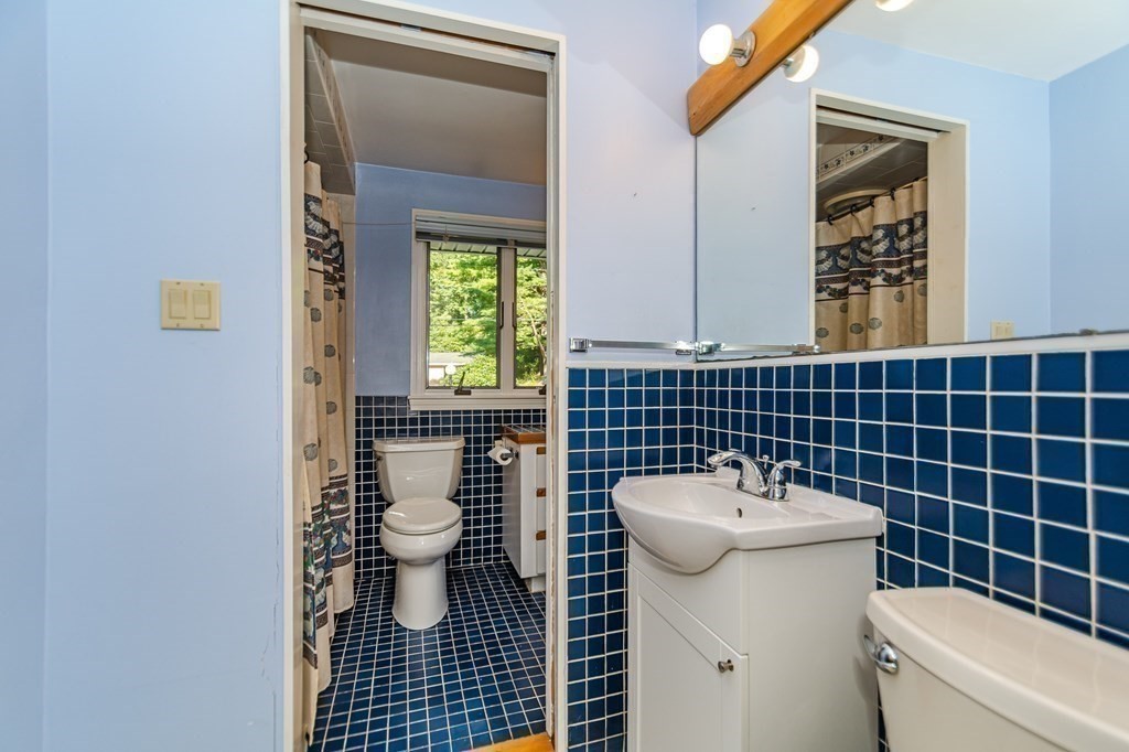 7 Ruthellen Road Chelmsford, MA 01824 - Photo 38 of 40 a bathroom with a sink and a toilet