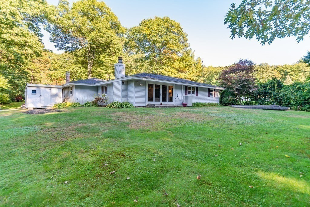 7 Ruthellen Road Chelmsford, MA 01824 - Photo 4 of 40 a view of a house with a yard and sitting area