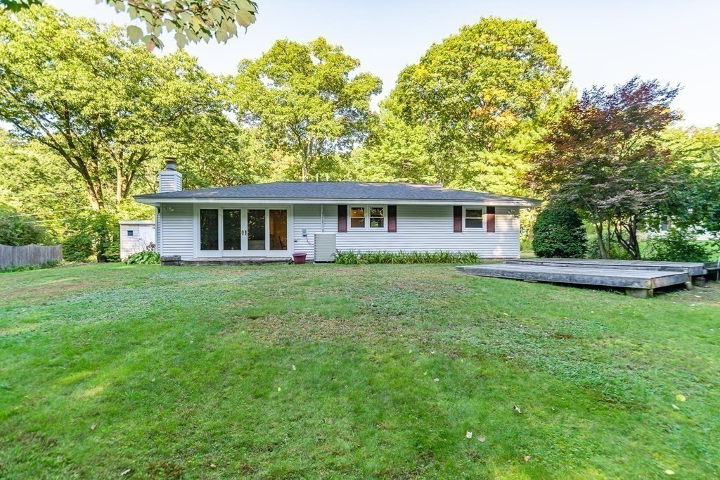 7 Ruthellen Road Chelmsford, MA 01824 - Photo 6 of 40 a view of a house with a backyard