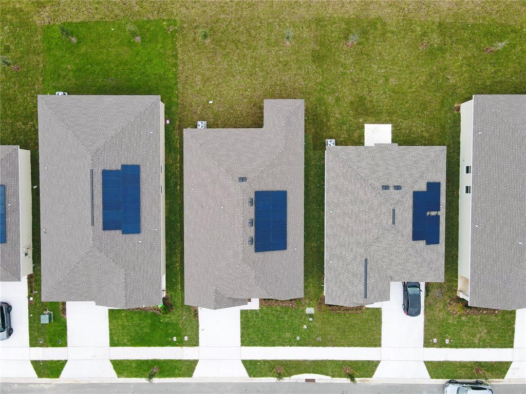 700 Daring Drive Davenport, FL 33837 - Photo 16 of 22 an aerial view of a house with a yard and lake view