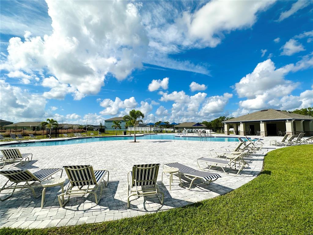 700 Daring Drive Davenport, FL 33837 - Photo 18 of 22 a view of a patio with furniture and a yard