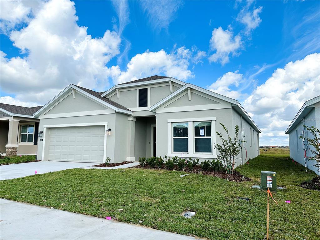 700 Daring Drive Davenport, FL 33837 - Photo 4 of 22 a front view of house with yard and green space
