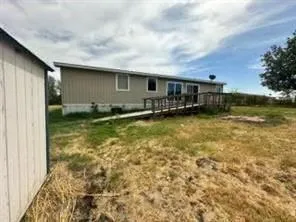 a view of a water fountain and a big yard
