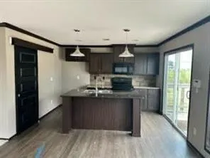 a kitchen with stainless steel appliances granite countertop a stove and a refrigerator