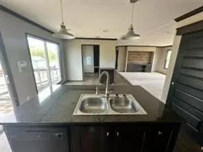 a kitchen with sink and window