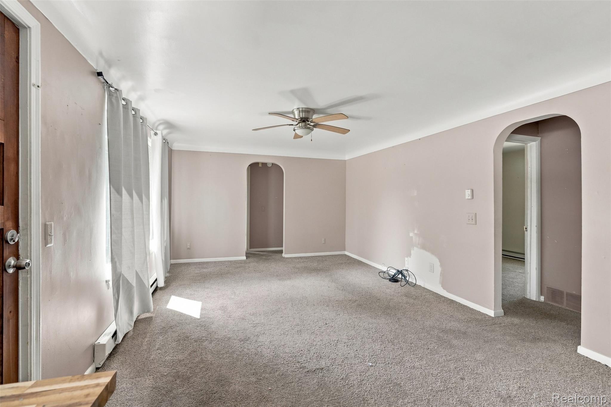 5161 Parker Road Fort Gratiot, MI 48059 - Photo 9 of 64 Spacious primary suite featuring soft neutral walls, ceiling fan with integrated lighting, and direct access to an ensuite bathroom