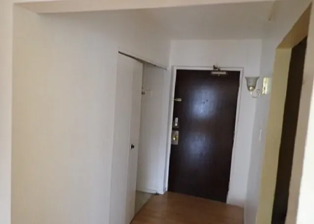 a view of a brick house with a yard