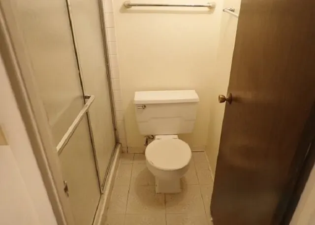 a kitchen with a sink a stove and cabinets